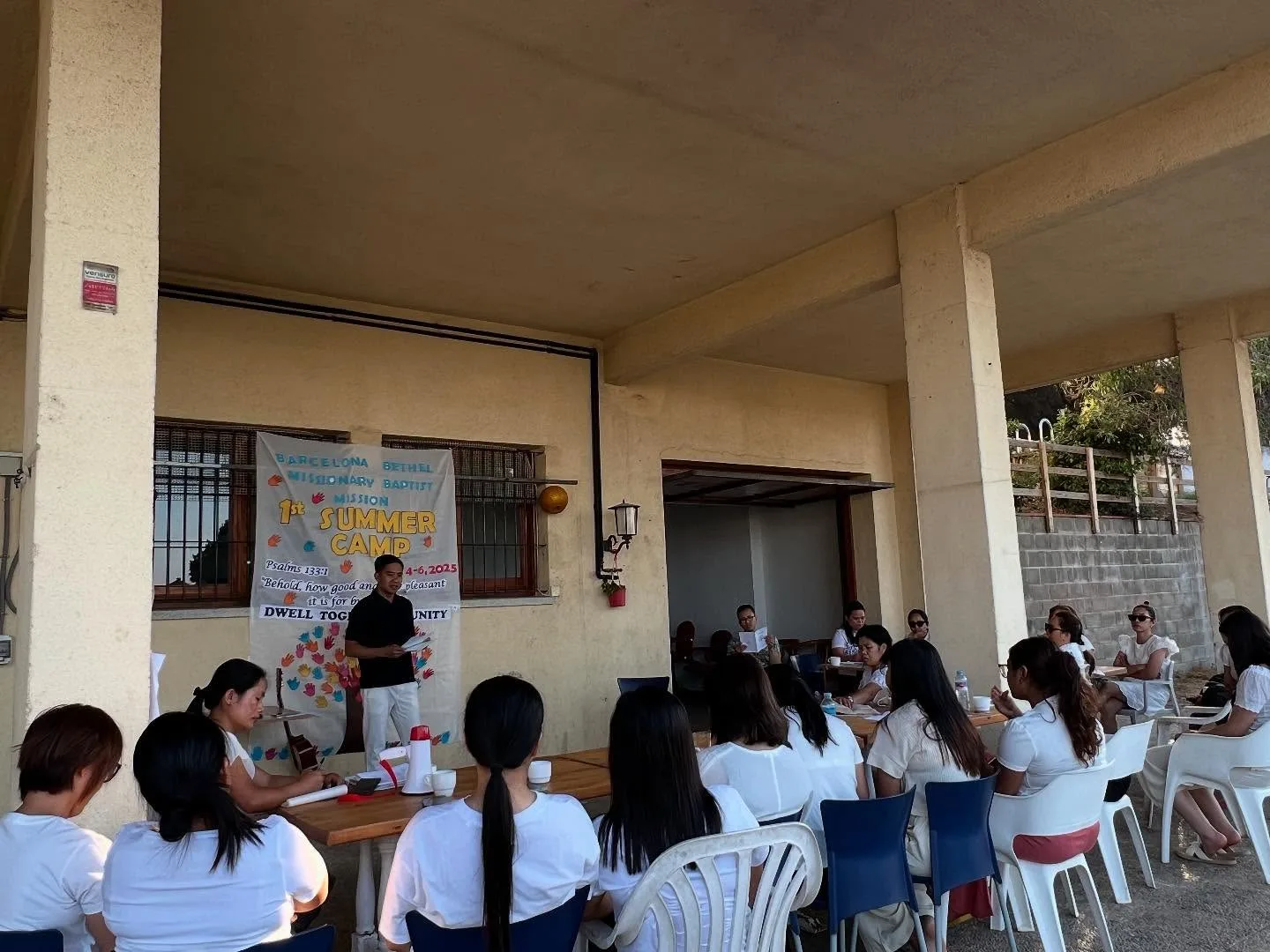 A speaker teaching the group at summer church camp