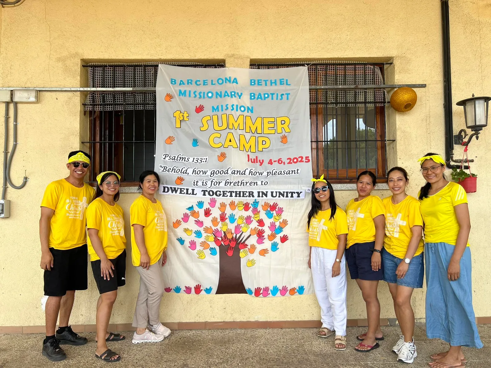 Camp participants in yellow shirts posing together